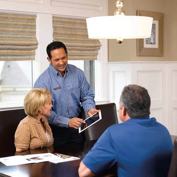 service tech talking to couple