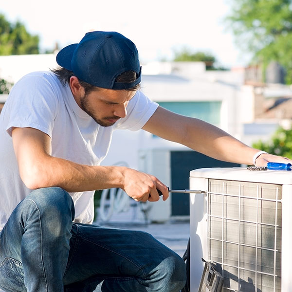 serviceman with heat pump